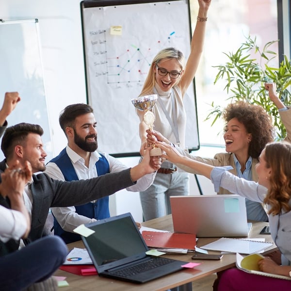 diverse-corporate-team-celebrating-together-art-conference-table crop